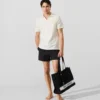 Polohemd mit Monogramm-Ansteckpin Polohemd mit Monogramm-Ansteckpin