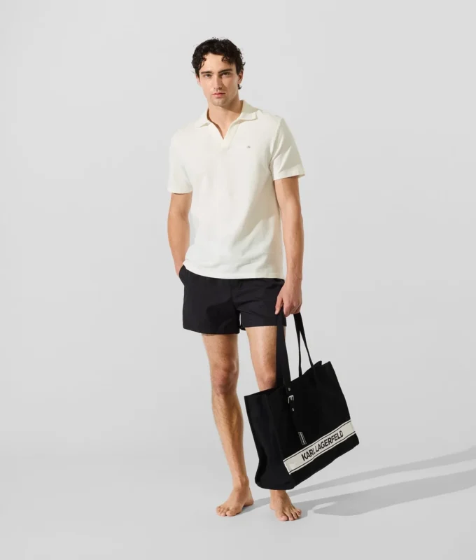 Polohemd mit Monogramm-Ansteckpin Polohemd mit Monogramm-Ansteckpin